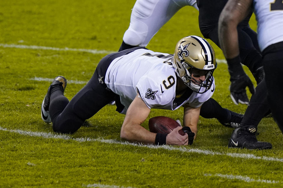 New Orleans Saints quarterback Drew Brees (9) recovers a fumble in the first half of an NFL football game against the Chicago Bears in Chicago, Sunday, Nov. 1, 2020. (AP Photo/Nam Y. Huh)