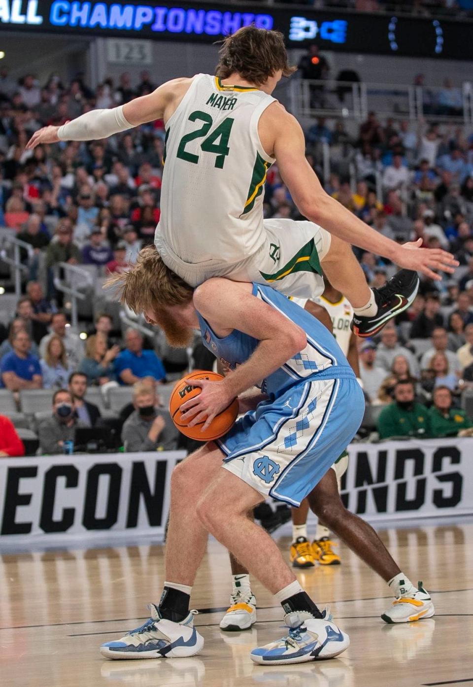 Baylors Matthew Mayer (24) lands in the back of North Carolinas Brady Manek (45) during the first half on Saturday, March 19, 2022 during the NCAA Tournament at Dickies Arena in Ft. Worth, TX.