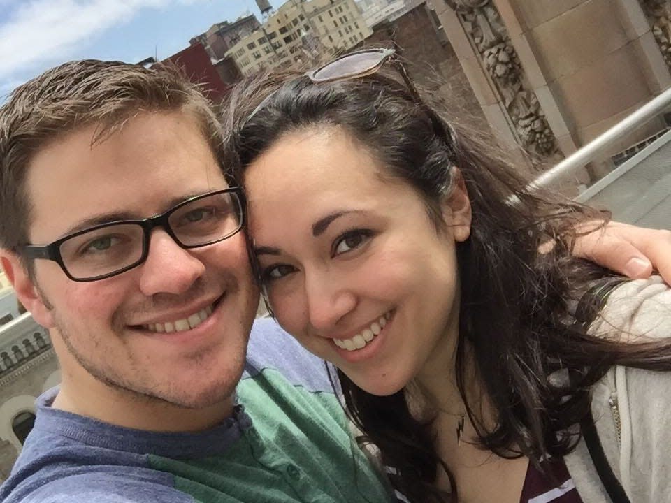 a couple takes a selfie outside