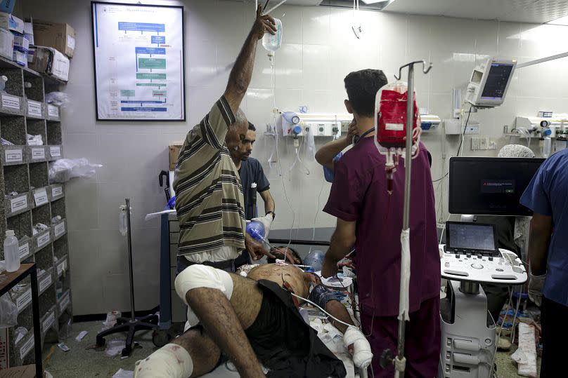 A Palestinian man wounded in the Israeli bombardment of the Gaza Strip is treated in a hospital in Khan Younis.