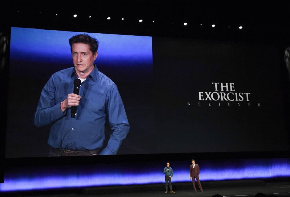 David Gordon Green on stage with Jason Blum at CinemaCon 2023