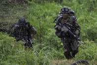 Japan's Self-Defense Force soldiers take part in a joint military drill between Japan Self-Defense Force, French army and U.S. Marines, at the Kirishima exercise area in Ebino, Miyazaki prefecture, southern Japan Saturday, May 15, 2021. (Charly Triballeau/Pool Photo via AP)