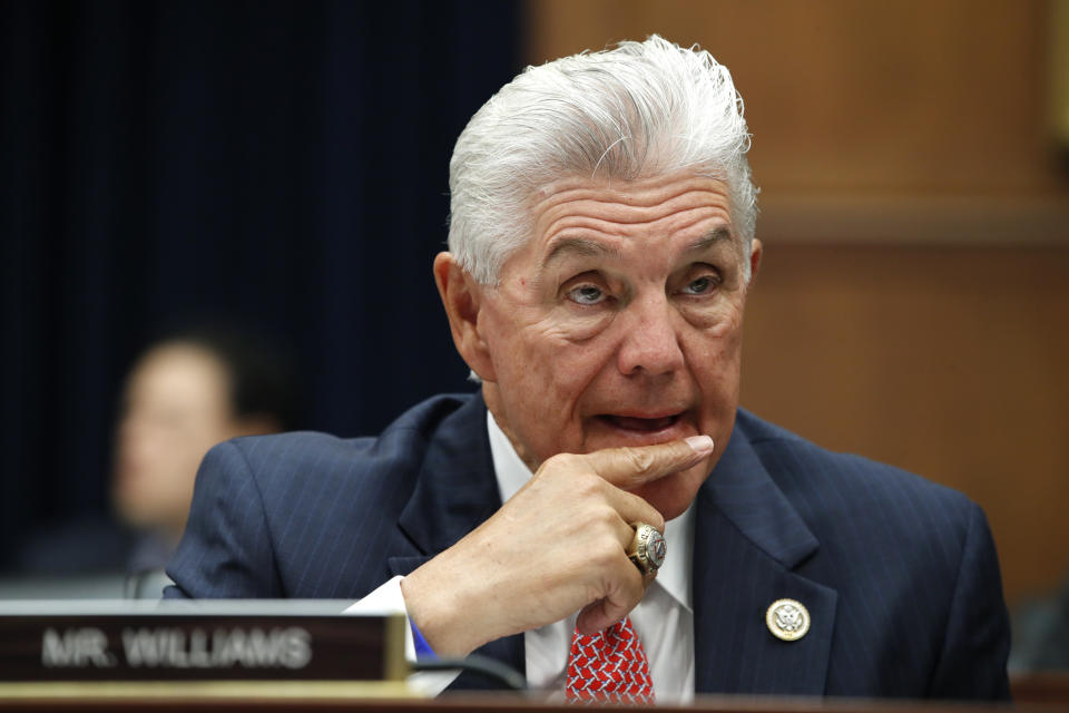 FILE - In this July 12, 2018, file photo Rep. Roger Williams, R-Texas, listens to testimony from Treasury Secretary Steven Mnuchin during a hearing with the House Financial Services Committee on Capitol Hill in Washington. At least 10 lawmakers and three congressional caucuses have ties to organizations that received federal coronavirus aid, according to government data released this week. Among businesses that received money was a car dealership owned by Williams. (AP Photo/Jacquelyn Martin, File)