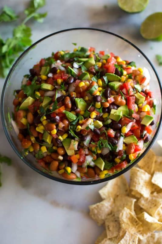 <p>Tastes Better from Scratch</p><p>I can’t think of a more delicious and summer appetizer than Cowboy Caviar! This simple chip dip is always a party favorite and besides being so easy to make, I especially love how fresh and healthy it is.</p><p><strong>Get the Recipe: </strong><a href="https://tastesbetterfromscratch.com/cowboy-salsa/" rel="nofollow noopener" target="_blank" data-ylk="slk:Cowboy Caviar;elm:context_link;itc:0;sec:content-canvas" class="link ">Cowboy Caviar</a></p>