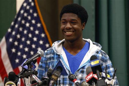 Kwasi Enin, a high school senior, smiles after announcing he will attend Yale University during a press conference at William Floyd High School in Mastic Beach, New York April 30, 2014. REUTERS/Shannon Stapleton