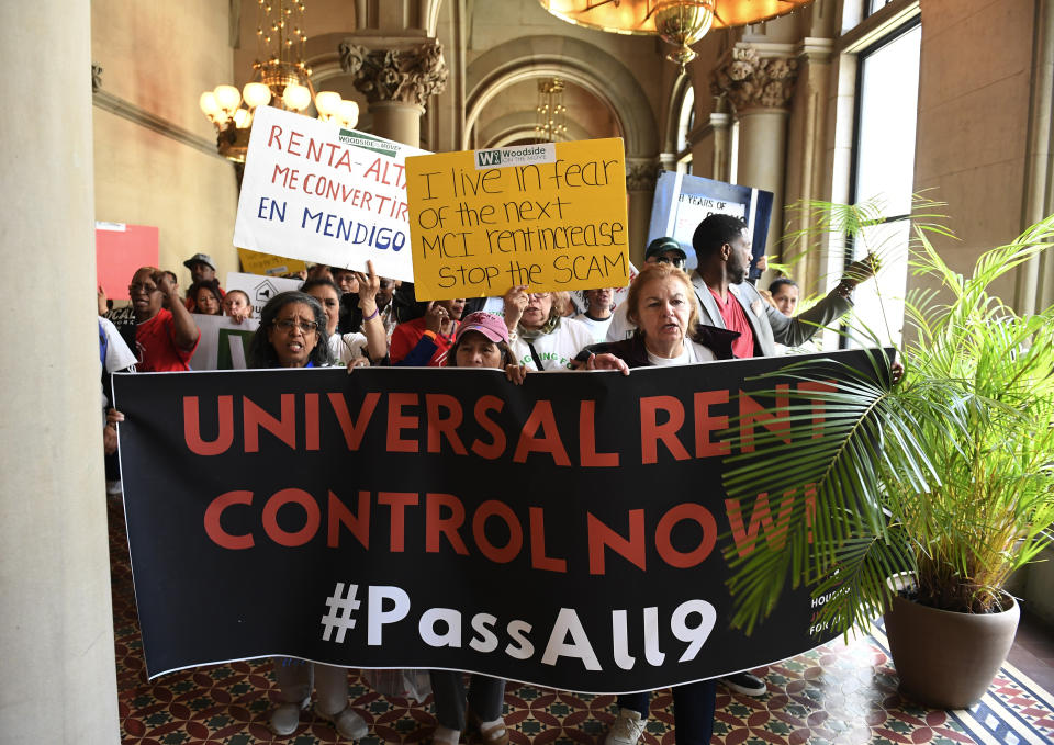 Tenants and members of the Upstate Downstate Housing Alliance from across the state, demand New York Gov. Andrew Cuomo and state legislators pass universal rent control legislation that would strengthen and expand tenants rights across the state of New York before rent laws expire on June 15th during a protest rally at the state Capitol Tuesday, June 4, 2019, in Albany, N.Y. (AP Photo/Hans Pennink)