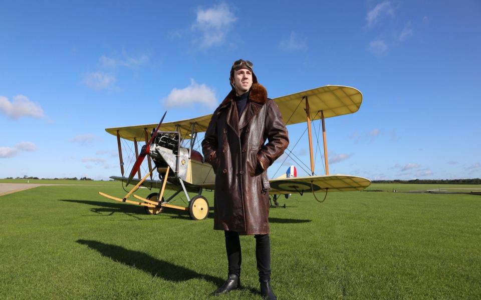 Telegraph writer Richard Jones with the WW1 spotter plane BE2C replica owned by Matthew Boddington at Sywell Aerodrome near Northampton - John Lawrence