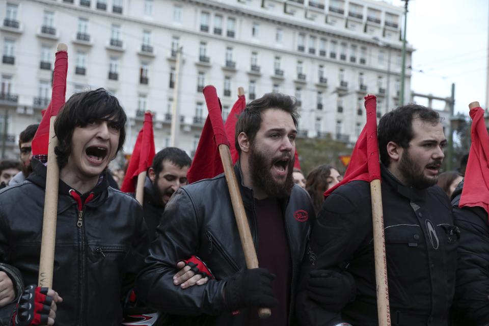 Protesters shout slogans during a rally in Athens, Saturday, Nov. 17, 2018. Several thousands people march to the U.S. Embassy in Athens under tight police security to commemorate a 1973 student uprising that was crushed by Greece's military junta, that ruled the country from 1967-74. (AP Photo/Yorgos Karahalis)