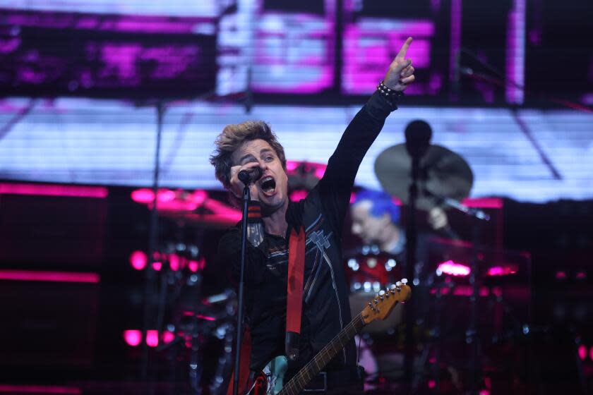 Inglewood, CA - September 14: Billie Joe Armstrong performs alongside Tre Cool with their band Green Day during The Saviors Tour at SoFi Stadium on Saturday, Sept. 14, 2024 in Inglewood, CA. (Michael Blackshire / Los Angeles Times)