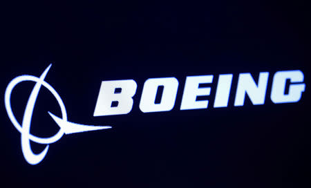 FILE PHOTO: The company logo for Boeing is displayed on a screen on the floor of the New York Stock Exchange (NYSE) in New York, U.S., March 11, 2019. REUTERS/Brendan McDermid/File Photo