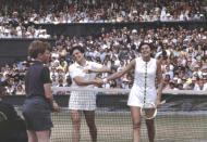 USA's Billie Jean King, left, winner, and Australia's Judy Tegart, shake hands at the end of the women's tennis final at Wimbledon, in July 1968. It’s the 50th anniversary of Billie Jean King and eight other women breaking away from the tennis establishment in 1970 and signing a $1 contract to form the Virginia Slims circuit. That led to the WTA Tour, which offers millions in prize money. (AP Photo/Robert Dear)