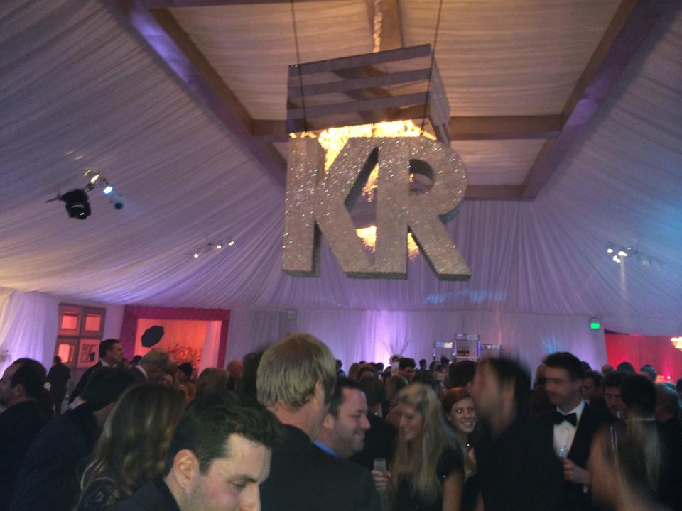 A giant “KR” hangs over the crowd at Kaley Cuoco and Ryan Sweeting’s wedding celebration in 2013. (Photo: Courtesy of Premiere Props)