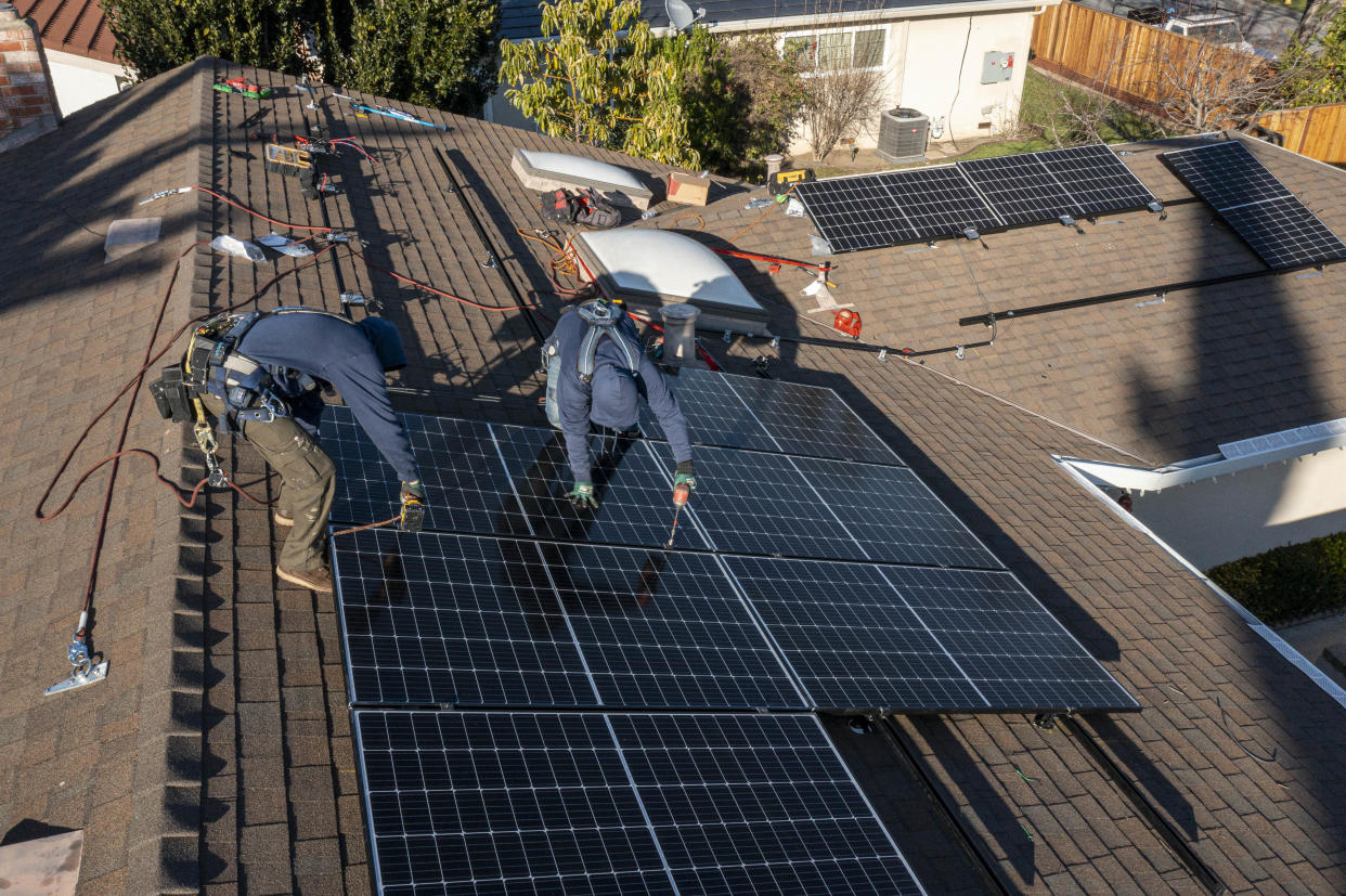 Solar panels are installed on the roof of a home in San Jose, Calif.