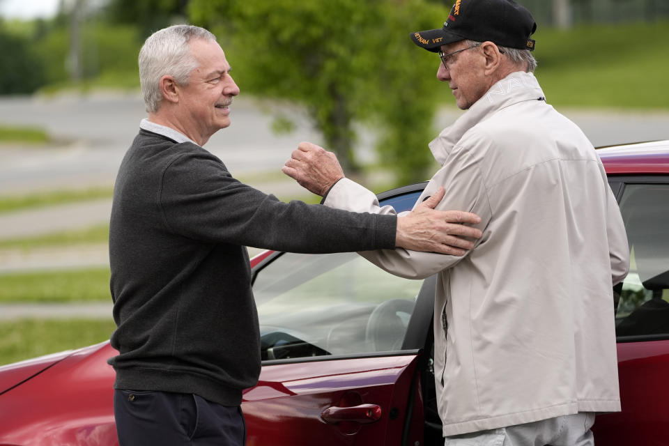 State Rep. Mike Soboleski, R-Phillips, left, talks with a voter, Tuesday, June 11, 2024, in Bangor, Maine. Soboleski is facing in State Rep. Austin Theriault, R-Fort Kent, in the Republican primary for the chance to try to unseat Jared Golden, one of the most conservative Democrats in the U.S. House of Representatives. (AP Photo/Robert F. Bukaty)