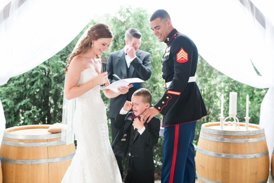 A marine’s son wept in his new stepmom’s arms at the wedding. (Credit: Jessica Husted Photography)