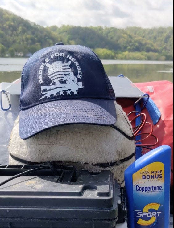 Curtis Casto finds a traveling companion on the Ohio River, Spalding the threadbare basketball.