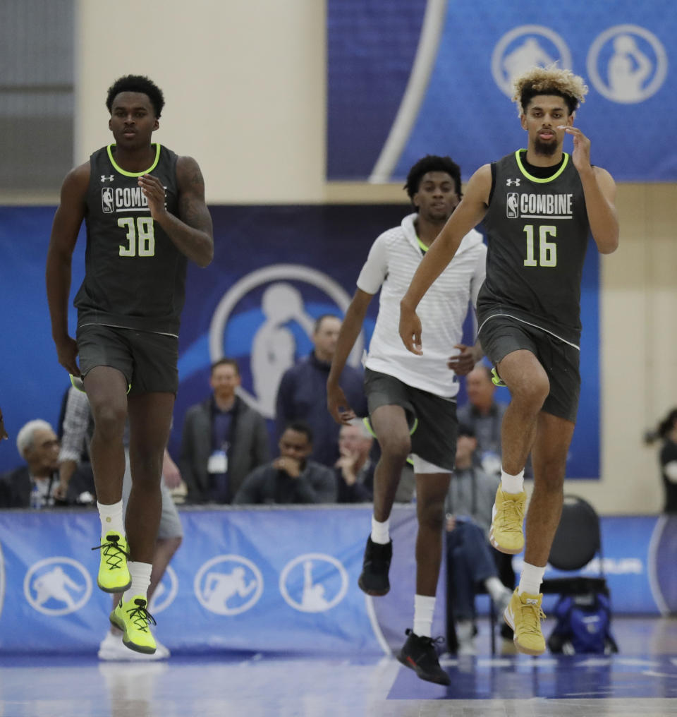 Kris Wilkes, left, and Brian Bowen participate in the second day of the NBA draft basketball combine in Chicago, Friday, May 17, 2019. (AP Photo/Nam Y. Huh)