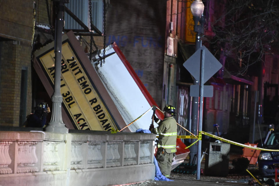 Authorities work the scene at the Apollo Theatre after a severe spring storm caused damage and injuries during a concert, late Friday, March 31, 2023, in Belvidere, Ill. (AP Photo/Matt Marton)