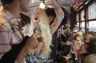 Models wear creations onboard a tram as part of the Missoni Spring-Summer 2020 collection, unveiled during the fashion week, in Milan, Italy, Thursday, Sept. 19, 2019. (AP Photo/Luca Bruno)