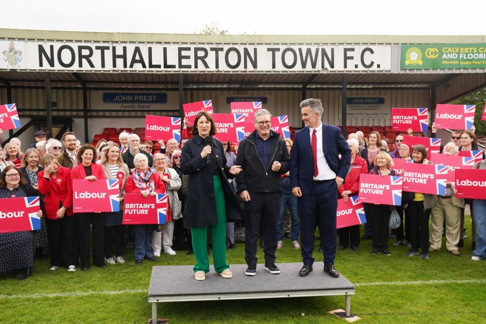 Sir Keir Starmer (centre) and shadow chancellor Rachel Reeves celebrate with David Skaith at Northallerton Town Football Club (Owen Humphreys/PA Wire)