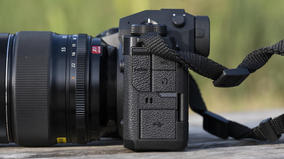 The Fujifilm X-H2S camera sitting on a wooden bench