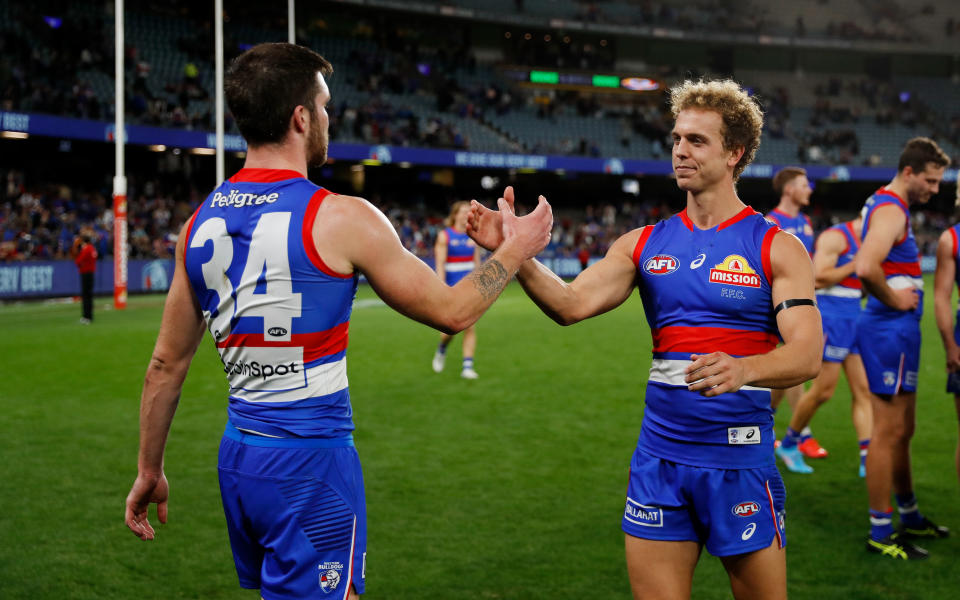 Mitch Wallis, pictured here with Bailey Williams after the Western Bulldogs' win over Essendon.