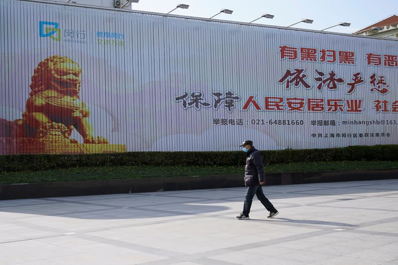 A man wearing face mask is seen in Qibao, an old river town on the outskirts of Shanghai