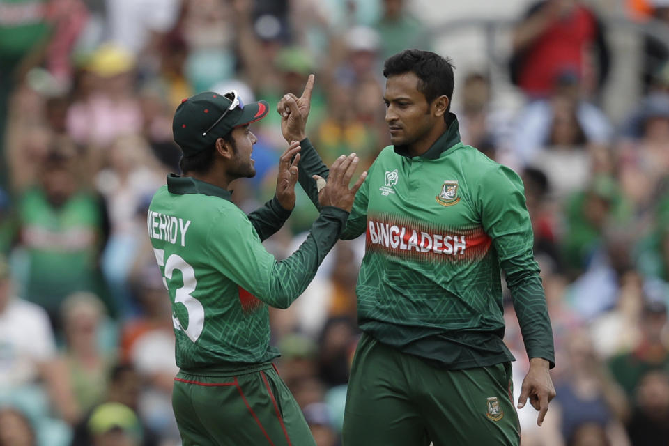 Bangladesh's Shakib Al Hasan, right, celebrates taking the wicket of South Africa's Aiden Markram with Bangladesh's Mehedi Hasan during the Cricket World Cup match between South Africa and Bangladesh at the Oval in London, Sunday, June 2, 2019. (AP Photo/Matt Dunham)