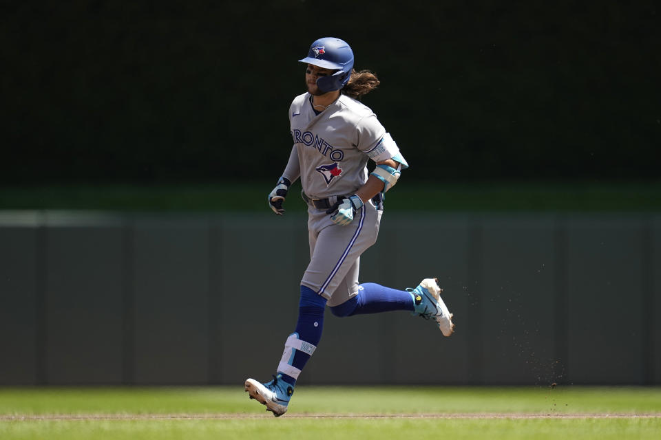 Toronto Blue Jays' Bo Bichette runs the bases after hitting a solo home run against the Minnesota Twins during the first inning of a baseball game Saturday, May 27, 2023, in Minneapolis. (AP Photo/Abbie Parr)