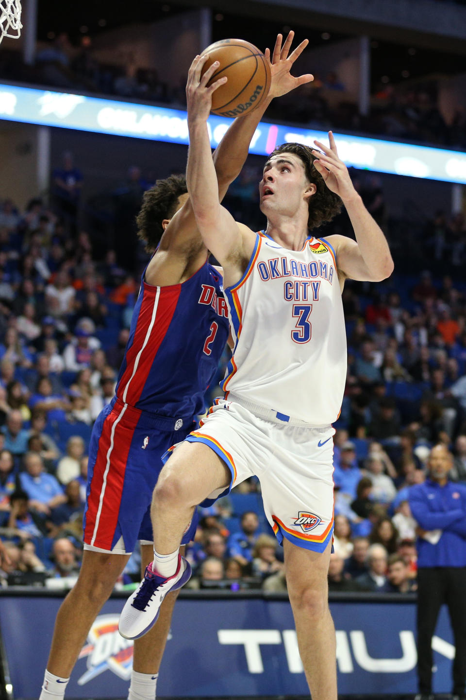 Oct 19, 2023; Tulsa, Oklahoma, USA; Oklahoma City Thunder guard Josh Giddey (3) shoots past Detroit Pistons guard Cade Cunningham (2) the second half at BOK Center. Mandatory Credit: Joey Johnson-USA TODAY Sports