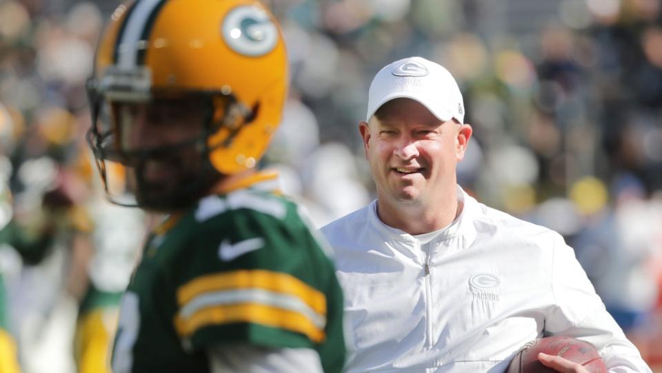 Green Bay Packers offensive coordinator Nathaniel Hackett talks with quarterback Aaron Rodgers (12) before their game against the Oakland Raiders Sunday, October 21, 2019 at Lambeau Field in Green Bay, Wis.