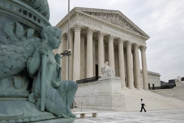 A police officer walks outside the Supreme Court (Patrick Semansky/AP)