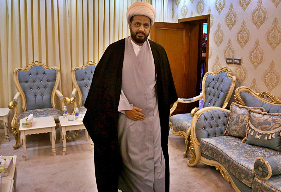 Qais al-Khazali, the leader of the militant Shiite group Asaib Ahl al-Haq, or League of the Righteous, arrives for an interview with The Associated Press, at the headquarters of his militia, in Baghdad, Iraq, Monday, Jan. 28, 2019. Al-Khazali said Monday that he expects a vote by the Iraqi parliament calling for the withdrawal of U.S. troops from the country within the next few months. Al-Khazali said there is no longer a justification for thousands of U.S. troops in the country after the Islamic State group has been defeated. (AP Photo/Khalid Mohammed)