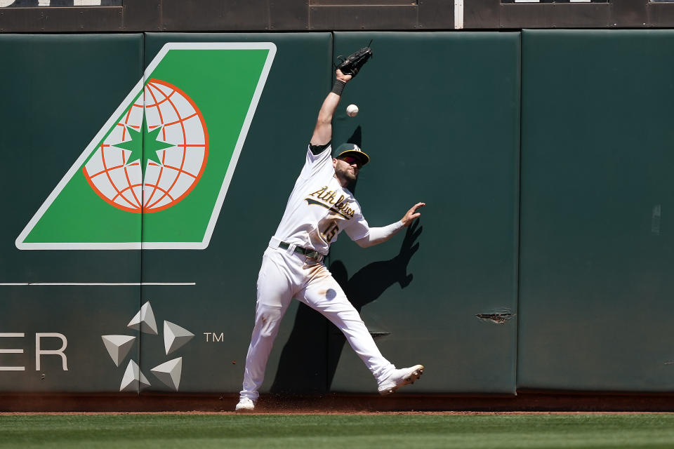 Oakland Athletics left fielder Seth Brown (15) cannot make the catch on a double by Cleveland Indians' Cesar Hernandez during the fifth inning of a baseball game Saturday, July 17, 2021, in Oakland, Calif. (AP Photo/Tony Avelar)