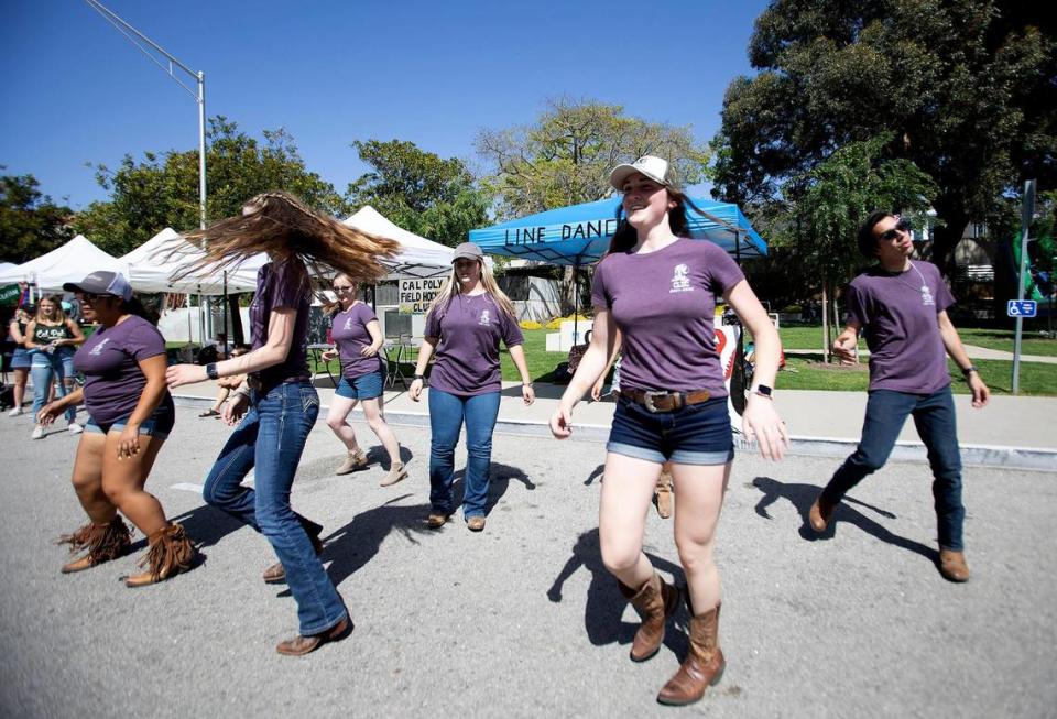 Members of the Country Line Dancing Club show off their moves during Cal Poly’s 29th annual Open House on Saturday, April 9, 2022. The event showcases campus programs to new students, families and the community. Laura Dickinson/ldickinson@thetribunenews.com