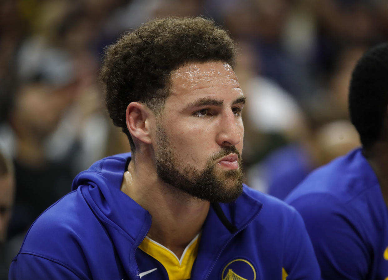 SACRAMENTO, CALIFORNIA - APRIL 16: Golden State Warriors' Klay Thompson #11 watches from the bench in the second quarter of their NBA play-in tournament game against the Sacramento Kings at the Golden One Center in Sacramento, Calif., on Tuesday, April 16, 2023. (Jane Tyska/Digital First Media/East Bay Times via Getty Images)