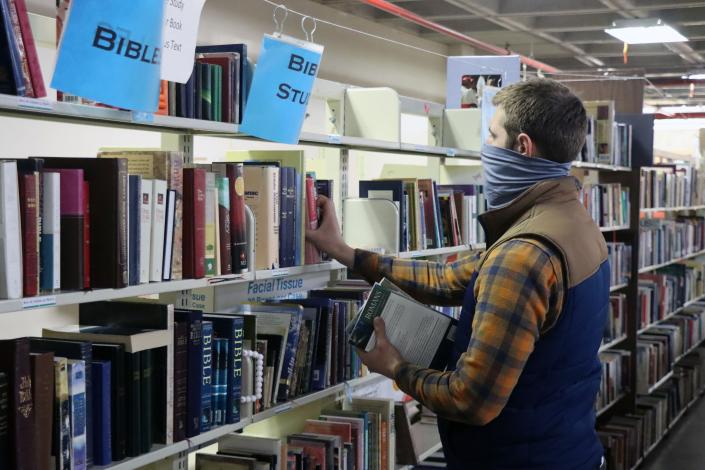 Grant Allard finds books of interest during the Friends of the Amarillo Public Library Book Sale which is held by appointment only.