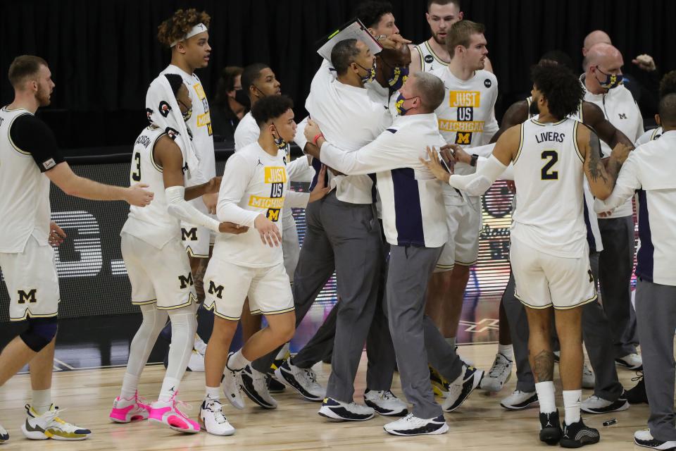 Michigan Wolverines head coach Juwan Howard is held back by his team and ejected against the Maryland Terrapins in the Big Ten tournament quarterfinals Friday, March 12, 2021 at Lucas Oil Stadium in Indianapolis.