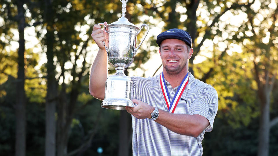 Seen here, Bryson DeChambeau holds the US Open trophy aloft.