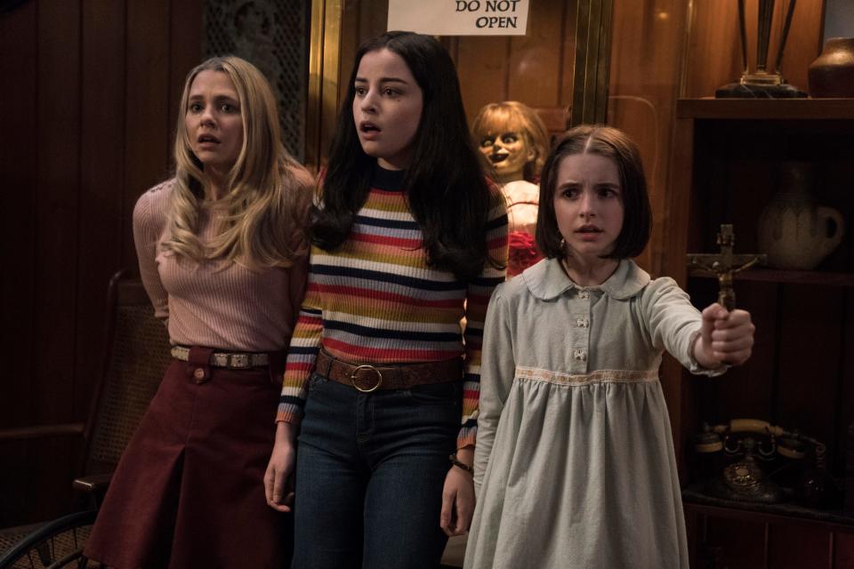 Madison Iseman (from left), Katie Sarife and Mckenna Grace star as youngsters dealing with a house of horrors in "Annabelle Comes Home."