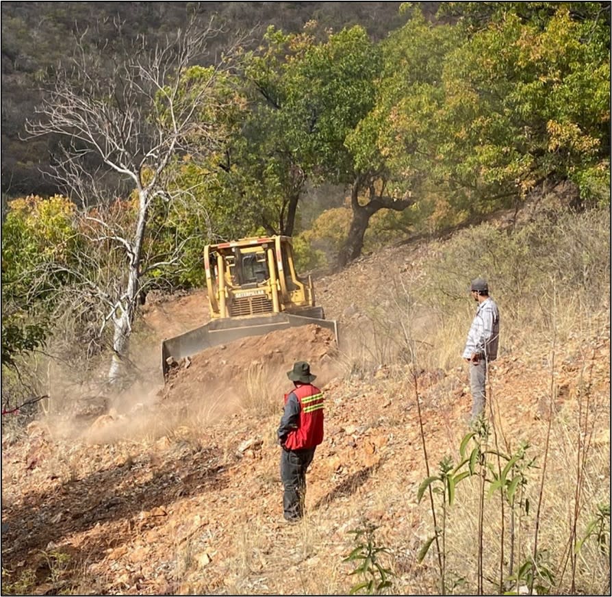 <i>Figure 2. Colibri geologist provides direction to equipment preparing trail and drill pads at Diamante 1.</i>