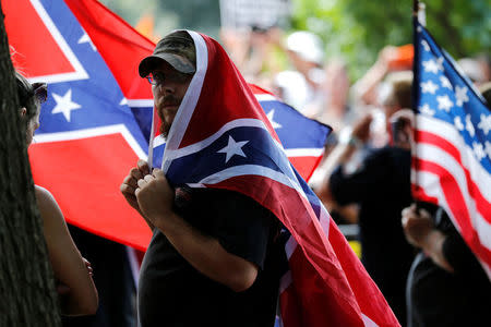 Members of the Ku Klux Klan rally in opposition to city proposals to remove or make changes to Confederate monuments in Charlottesville, Virginia, U.S. July 8, 2017. REUTERS/Jonathan Ernst