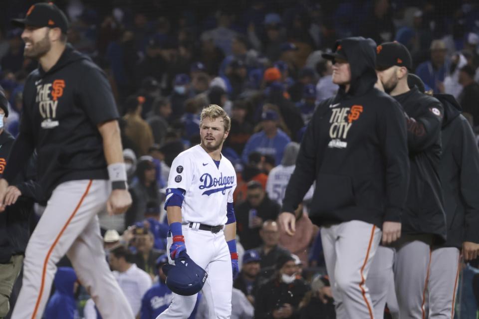 Dodgers' Gavin Lux reacts after flying out for final out.