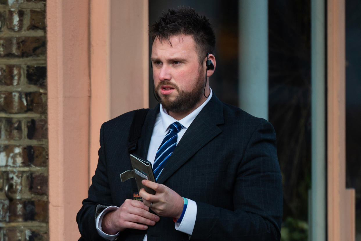 PC Andrew Brooks arrives at a disciplinary hearing at the Met Police headquarters in London. (SWNS)