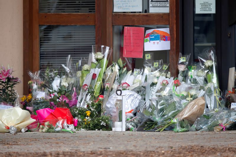 Flowers at the Bois d'Aulne college are seen after the attack in the Paris suburb of Conflans St Honorine