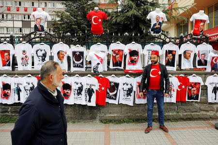 A street vendor sells t-shirts with portraits of modern Turkey's founder Mustafa Kemal Ataturk and Turkish President Tayyip Erdogan during a rally for the upcoming referendum in the Black Sea city of Rize, Turkey, April 3, 2017. Picture taken April 3, 2017. REUTERS/Umit Bektas