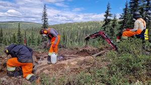 Workers stipping outcrop