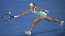 Magda Linette of Poland plays a forehand return to Ekaterina Alexandrova of Russia during their third round match at the Australian Open tennis championship in Melbourne, Australia, Saturday, Jan. 21, 2023. (AP Photo/Dita Alangkara)