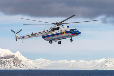A view shows the Russian-made Mil Mi-8 helicopter, that went missing October 26, 2017 with eight people aboard off the coast of the Arctic Svalbard archipelago, in the settlement of Barentsburg on Svalbard, Norway April 28, 2015. Picture taken April 28, 2015. REUTERS/Alexey Reznichenko