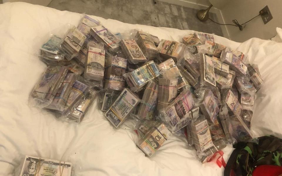 Cash seized by officers under the operation - Metropolitan Police